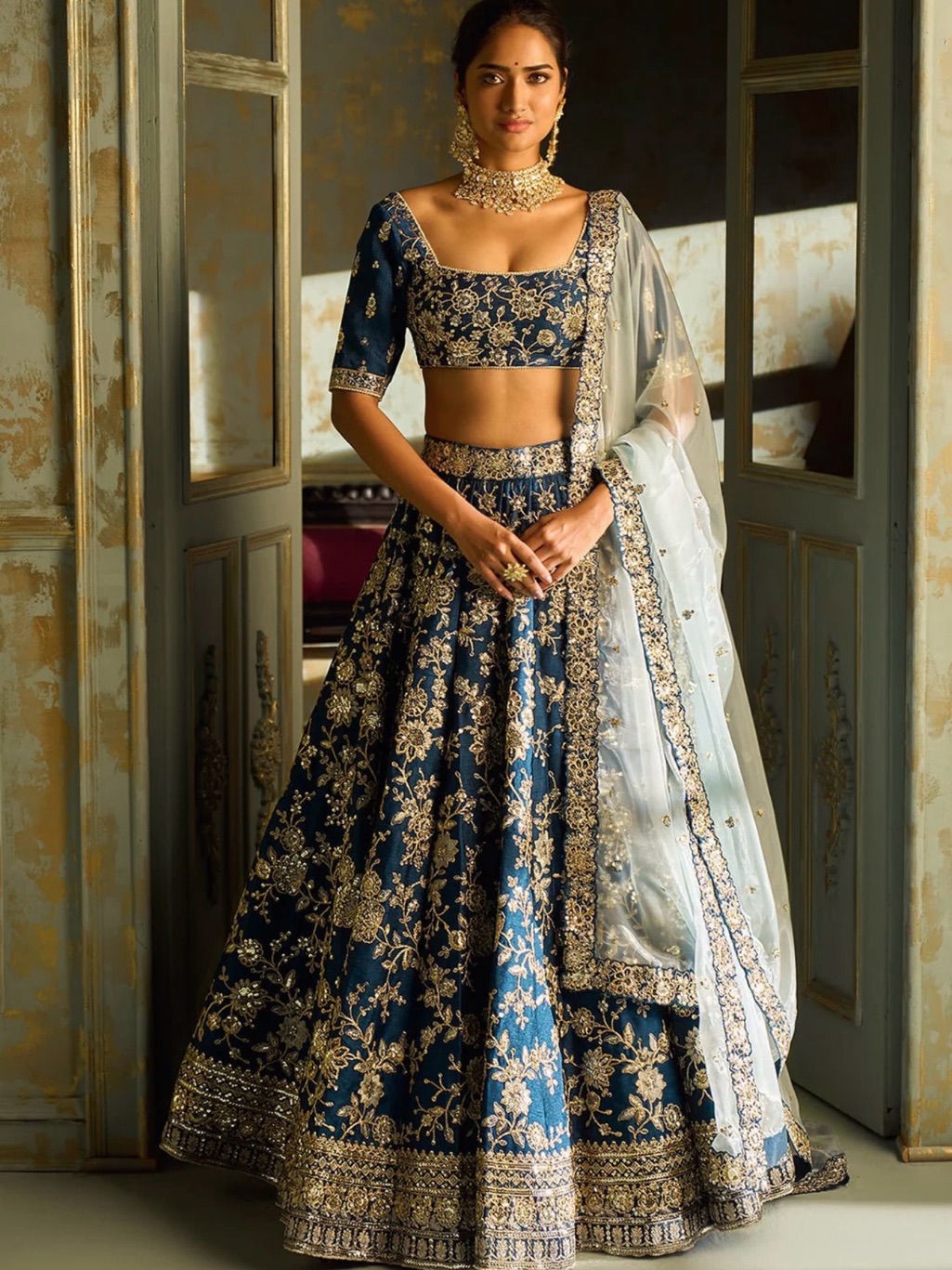 Navy Blue Bridal Lehenga With Gold Embroidery And Ivory Dupatta